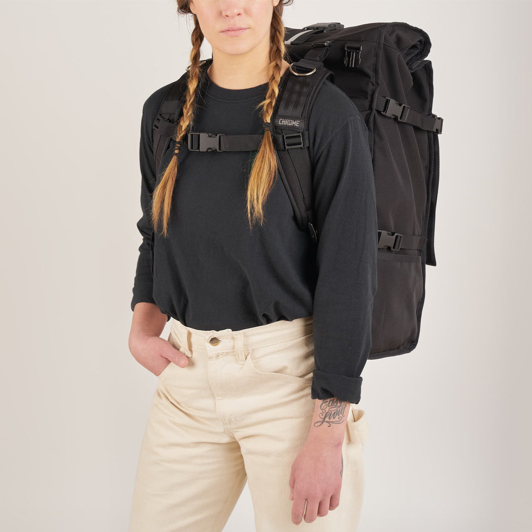 80L Barrage Pro backpack in black worn by a woman front view 