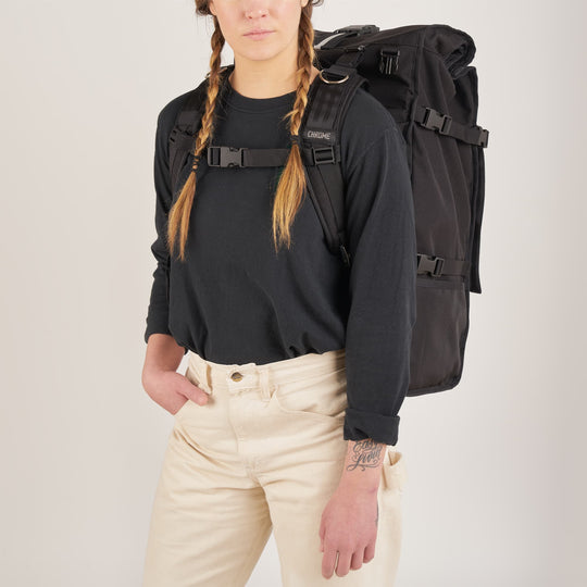 80L Barrage Pro backpack in black worn by a woman front view 