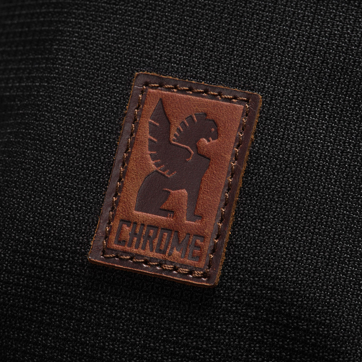 Leather patch on the Ruckas Accessory Pouch #color_black