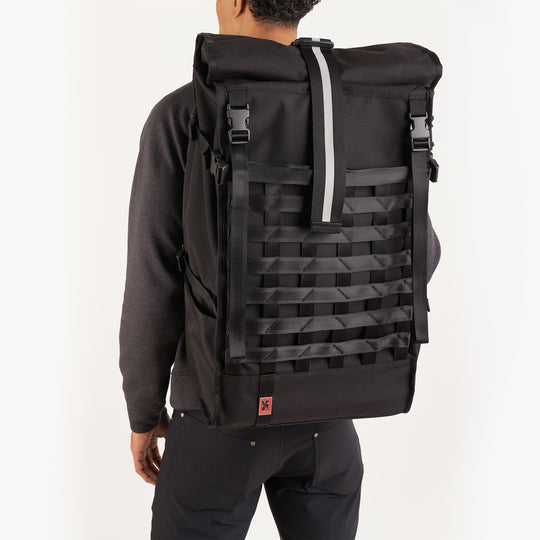Black Barrage Pro backpack on a man back view 